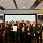 Photograph with representatives of ports, companies, institutions and governments from Holland and Brazil (states of Rio Grande do Sul, Parana and Ceara) at the partnership signing event.